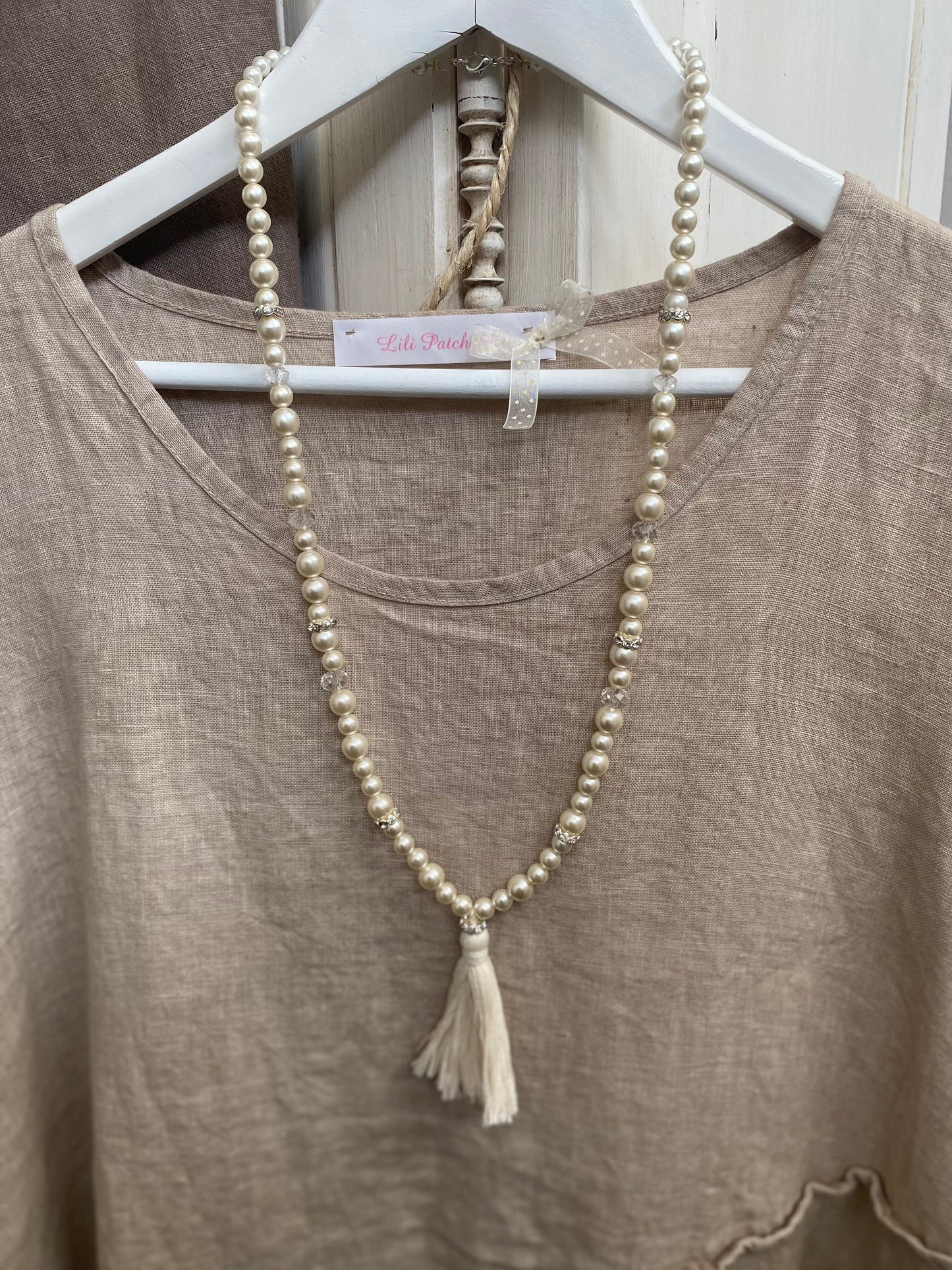 Collier perles et pompons